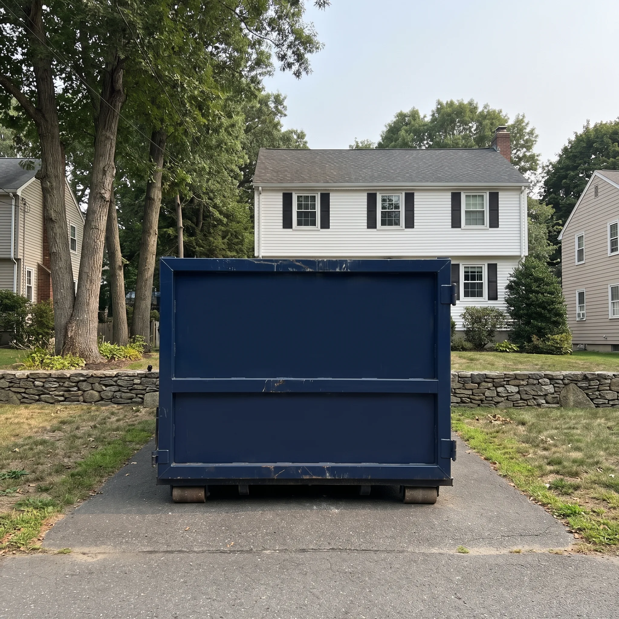 Roll-off dumpster on a Rhode Island job site